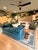 The daybed features a contemporary silhouette with clean lines, squared arm panels that wrap partially around the back,...