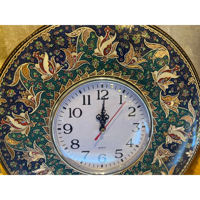 Handmade blue and green wall clock made by copper. Colorful floral design for hanging. Great for displaying your unique...