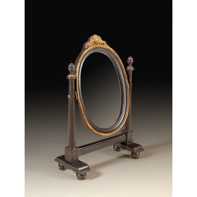 Handcrafted in Italy, this small tabletop shaving mirror features an oval tilting mirror set between turned supports. A...