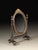 Handcrafted in Italy, this small tabletop shaving mirror features an oval tilting mirror set between turned supports. A...