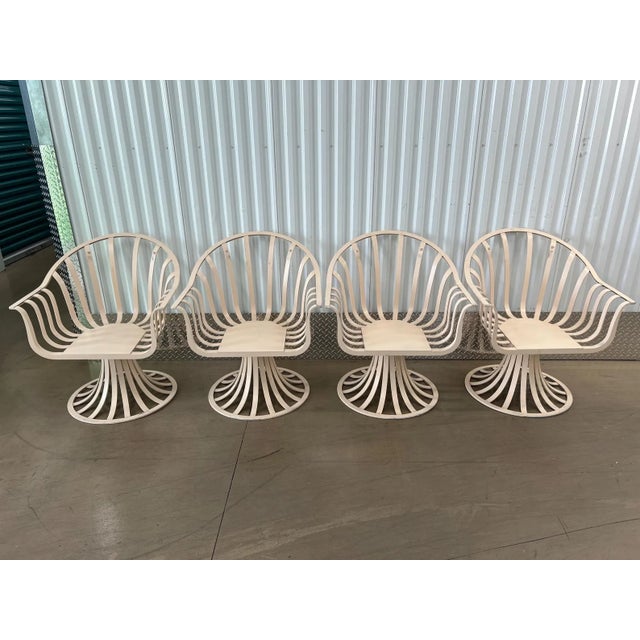 This is a great set of 4 Herbert Saiger for Woodard Patio chairs. They are in solid condition with no rust or corrosion....