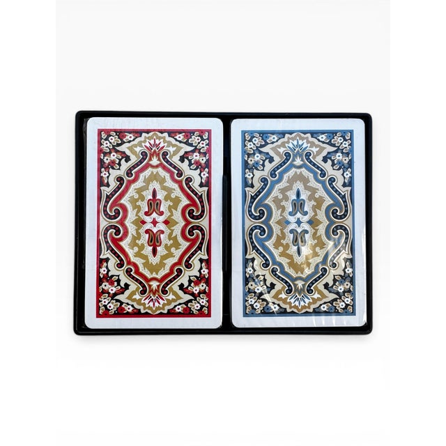 A double deck set of KEM Paisley playing cards in red and blue, made by The United States Playing Card Company circa 2010,...