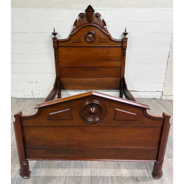 This is a gorgeous antique Victorian full sized bed crafted from richly figured walnut and features an impressive arched...