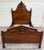 This is a gorgeous antique Victorian full sized bed crafted from richly figured walnut and features an impressive arched...
