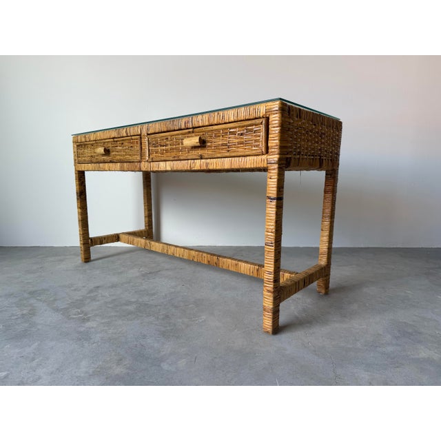 Elevate your space with this stunning Vintage Palm Beach Regency Coastal Rattan Console Table, a timeless piece that...