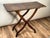 Elegant in its simplicity and ingenious in its construction, this English Regency folding table dates to approximately...