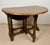 Spanish drop-leaf table dating from the mid-20th century. Crafted in wood, it features two folding leaves that transform...