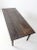 This early farmhouse table features a simple, honest design with a beautifully aged patina. The rectangular plank top...