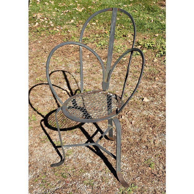 This pair of mid-century architectural garden or patio accent or dining chairs exhibit an exceptionally rare and graphic...
