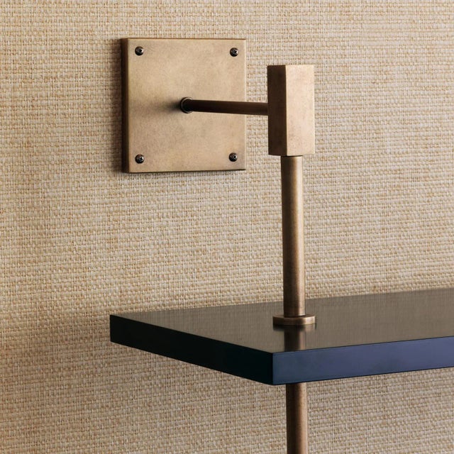 Port 68 Modern multi-tier shelf in aged brass and black, details urban simplicity with burnished finishes. As shown,...
