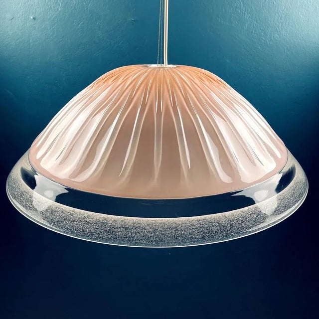 Mid-century pink Murano glass pendant lamp made in Italy in the 1970s. The stylish and elegant, this pink Murano glass...