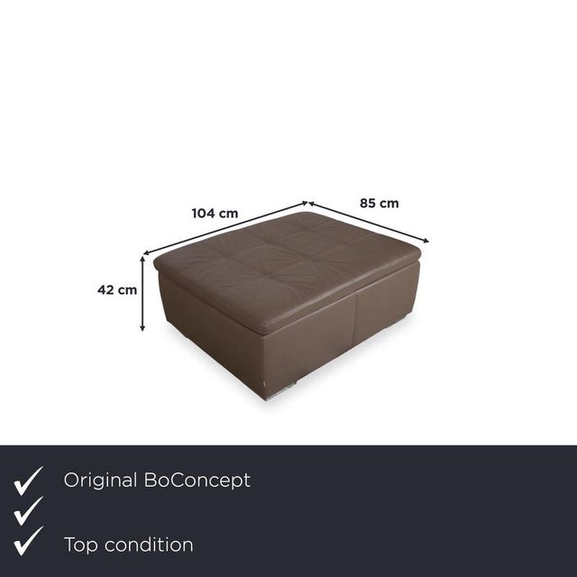 A thin seat cushion with elegant stitching, a solid frame, and discreetly concealed legs underscore the clean, elegant...