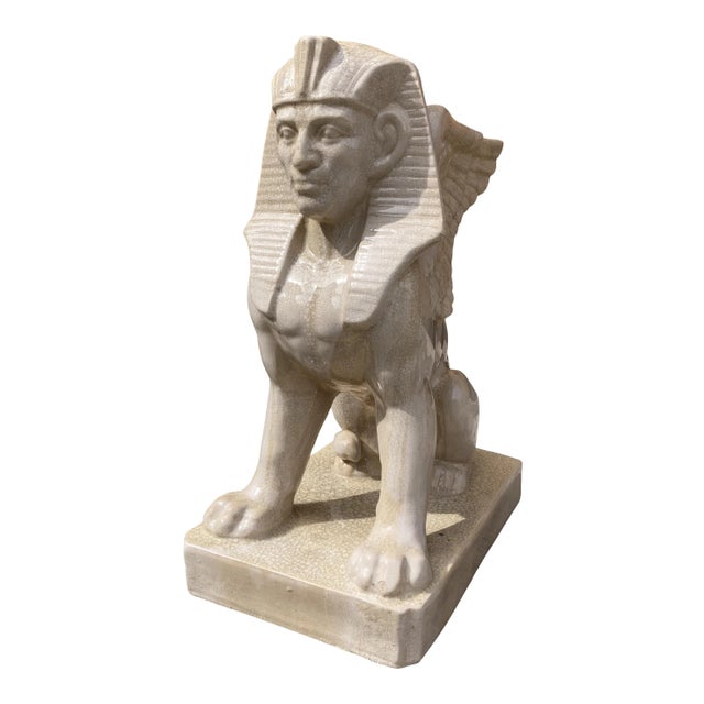 Large scale entryway statue an Egyptian Sphinx in crackle glazed porcelain, circa 1980s.