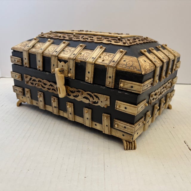 Anglo-Indian Vizagapatam Style Bombay jewel box, featuring contrasting black wood and intricately carved and engraved bone...