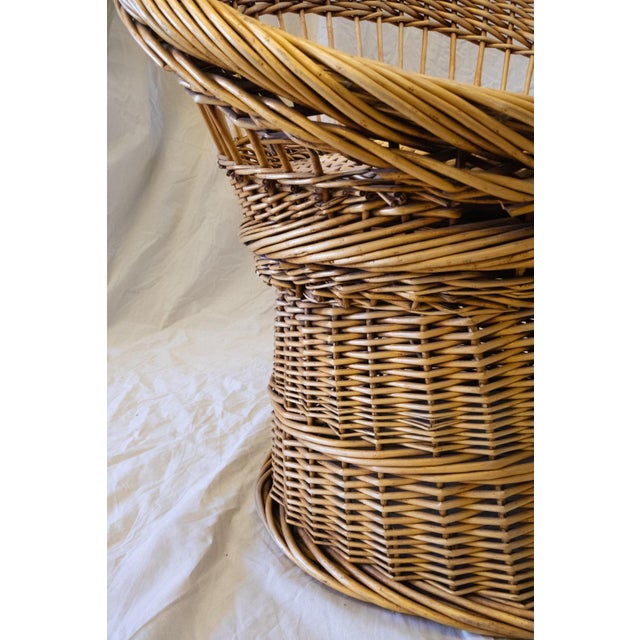 Woven Wicker Armchair – 1970s Crafted entirely in natural woven wicker, complete with a removable raffia cushion. Seat...