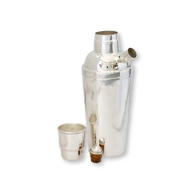 Early 20th century English cocktail shaker with sleek Art Deco styling and streamlined machine age silhouette. The...