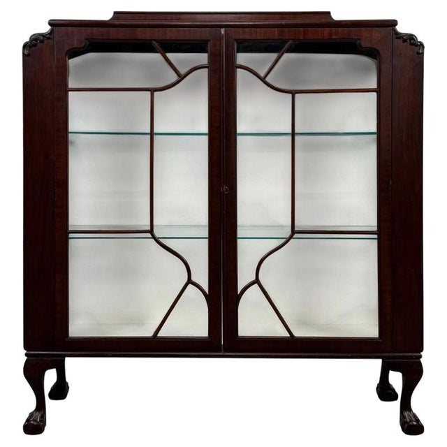 A beautifully proportioned early 20th-century English Edwardian display cabinet, finely constructed in mahogany and...