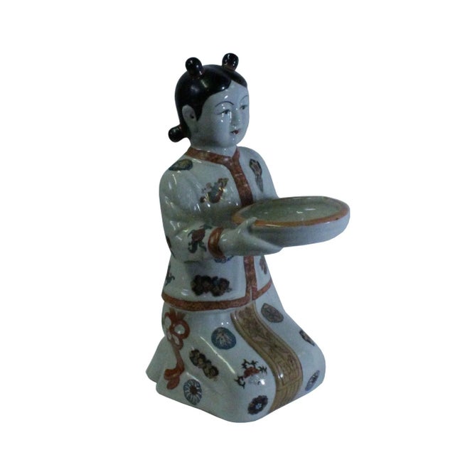 This is a hand made oriental vintage style Qing dressing lady holding dish figure. It was one of the popular ceramic...