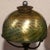 Tiffany Studios Bronze and favrile Desk lamp Damascene iridescent glass with greens, blues, goals and silver. Fine...