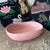 Elegant pink ceramic serving bowl. Mid century modern. Curled organic shape. Signed. In soft pink salmon pink apricot color.
