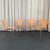 This set of four Scandinavian Modern "Series 7" chairs was designed by Arne Jacobsen in 1955 and manufactured by Fritz...