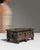 This early 20th century Spanish hand-carved wood box from France is carved in dark wood with a rustic, X-patterned front...