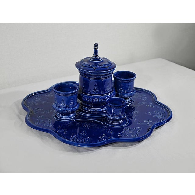 Beautiful earthenware set consisting of a polylobé plateau, a pot and three glasses of "blue of Sèvres" color. La...