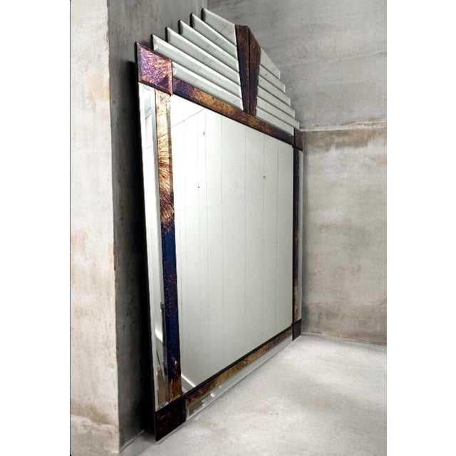 A vintage Art Deco wall mirror featuring multi-layered beveling and decorative colored glass accents. Originating in...