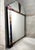 A vintage Art Deco wall mirror featuring multi-layered beveling and decorative colored glass accents. Originating in...