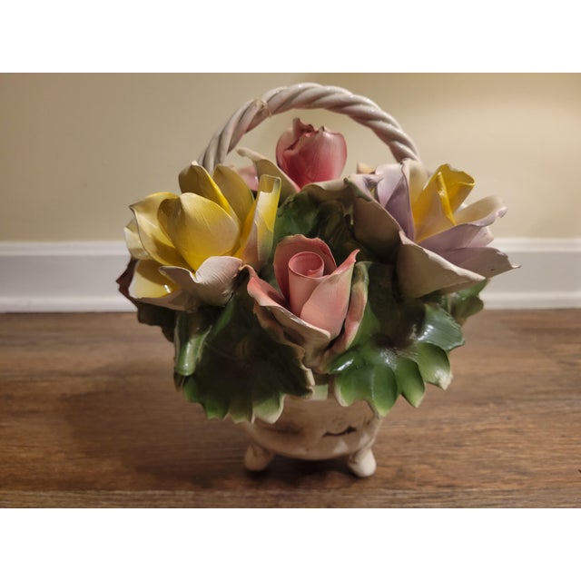 Beautiful vintage Italian Capodimonte porcelain floral basket featuring an elaborate arrangement of delicately sculpted...