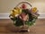 Beautiful vintage Italian Capodimonte porcelain floral basket featuring an elaborate arrangement of delicately sculpted...
