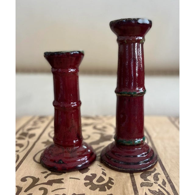 Bold and substantial, a set of two bamboo form candlestick holders in two heights. Each are covered with a generous glaze...