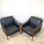 An elegant pair of Italian Modern lounge chairs defined by graceful sculptural lines and understated sophistication....