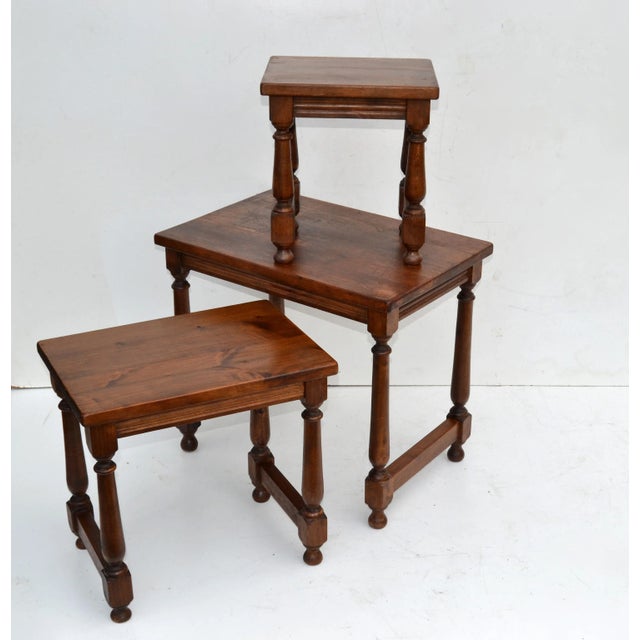 French Vintage Oak Wood Set of Three Nesting Tables, Stacking Tables with turned legs from the 1950s. Size of each table:...