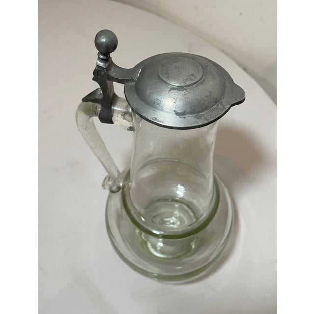 Up for sale is a large antique 19th century hand blown lidded German beer stein. It's completely blown by hand into a...