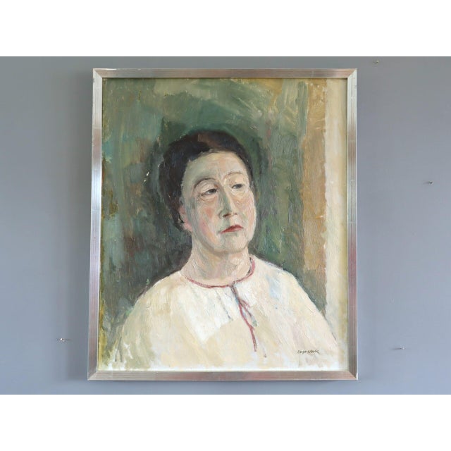 AGNES Size: 22.6 x 19.3 inches (including frame) Oil on canvas A thoughtful mid-century figurative portrait that captures...