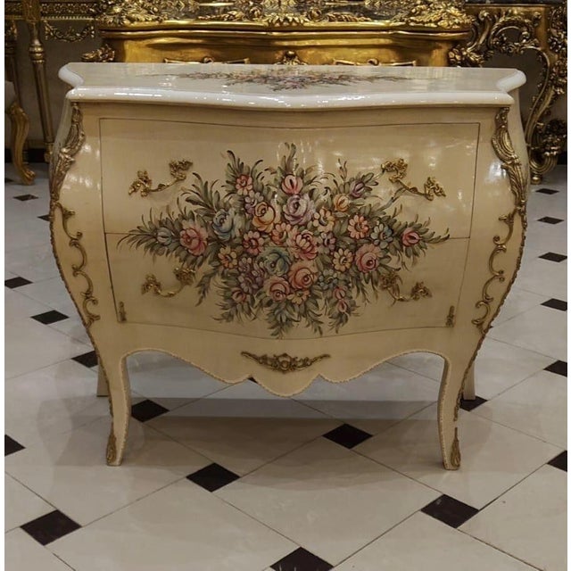 47.2 W x 21.7 D x 33.5 H DETAILS Style: Louis XV / French Rococo Elegant bombe commode silhouette Hand-painted floral...