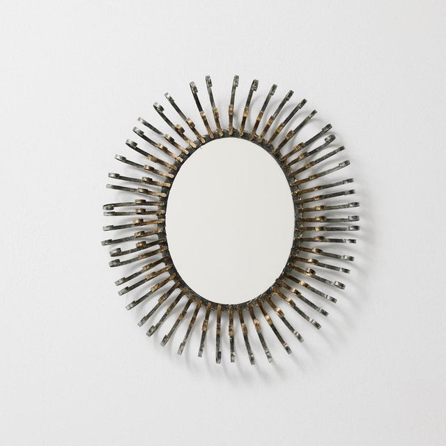 Brutalist Sunburst Mirror — France, 1970s Hand-Forged Metal with Original Patina This striking Brutalist sunburst mirror...