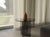 The Amami is a smoked glass side table, a study in transparency, built from Italian glass rather than stone. It trades...
