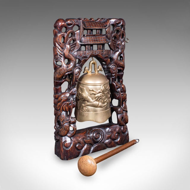 This is a vintage tea gong. An Oriental, mahogany framed dinner or prayer bell, dating to the Art Deco period, circa 1940....