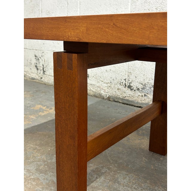 This solid teak table is a wonderful example of Danish craftsmanship and clean mid century lines. It appears to have a...