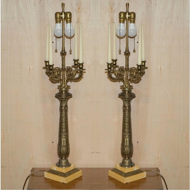 We are delighted to offer for sale this huge pair of original vintage warren kessler new york, repousse brass, four branch...