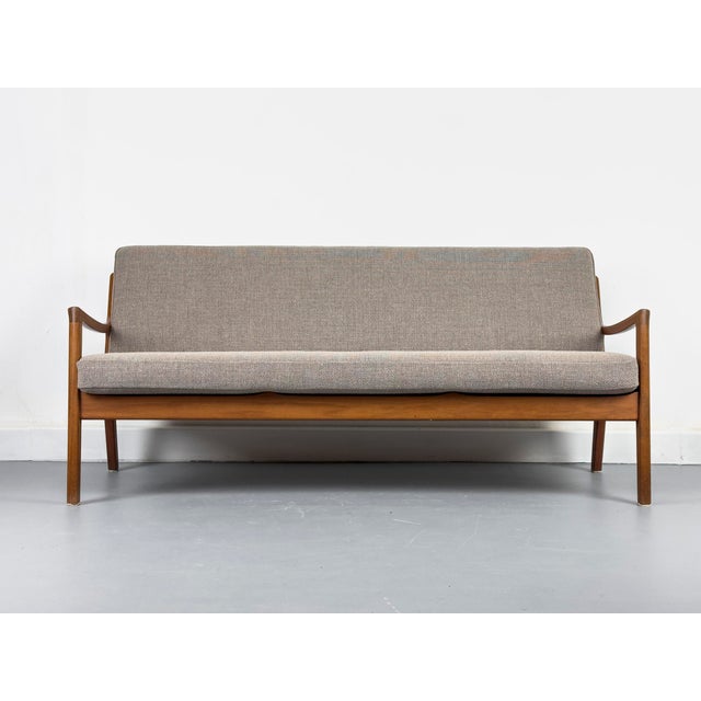 Elegant Senator sofa in high-quality teak, designed by Professor Ole Wanscher. The sofa impresses with its clean lines and...