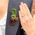 This sculptural multi-coloured brooch was created in Italy by Giorgio Armani in the 1990s. Condition Report: Excellent The...