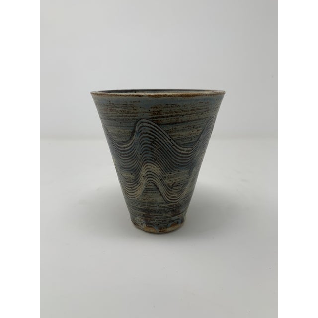 A mid century modern vase with heavy carvings. Circa 1960s