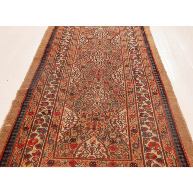 This antique Persian rug comes from one of the oldest weaving centers in the world, Hamadan, whose ancient name  Ecbatana...