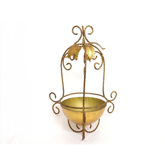 Vintage gilt metal hanging planter with leaves. Attached tag states Made in Italy. Full diameter/footprint is 20.5"....