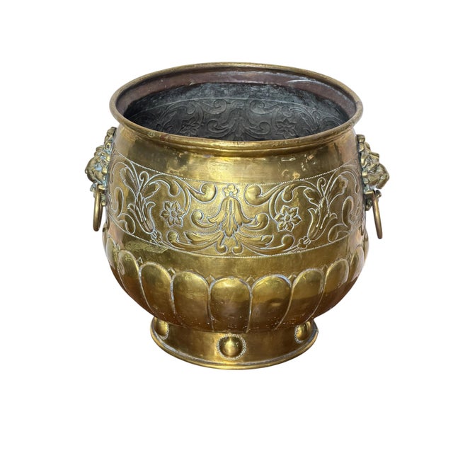 This is a lovely Victorian brass jardiniere (planter) featuring hand crafted repousse decorative floral panels and...