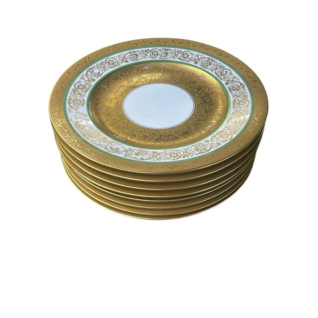 Set of 8 vintage to antique Bavarian made dinner plates. Large encrusted gold center band with smaller bands of gold,...