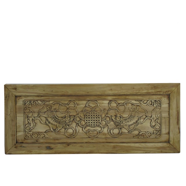 This antique panel is in its original warm original wood color with hand carved two dancing lions and decorative flowers....